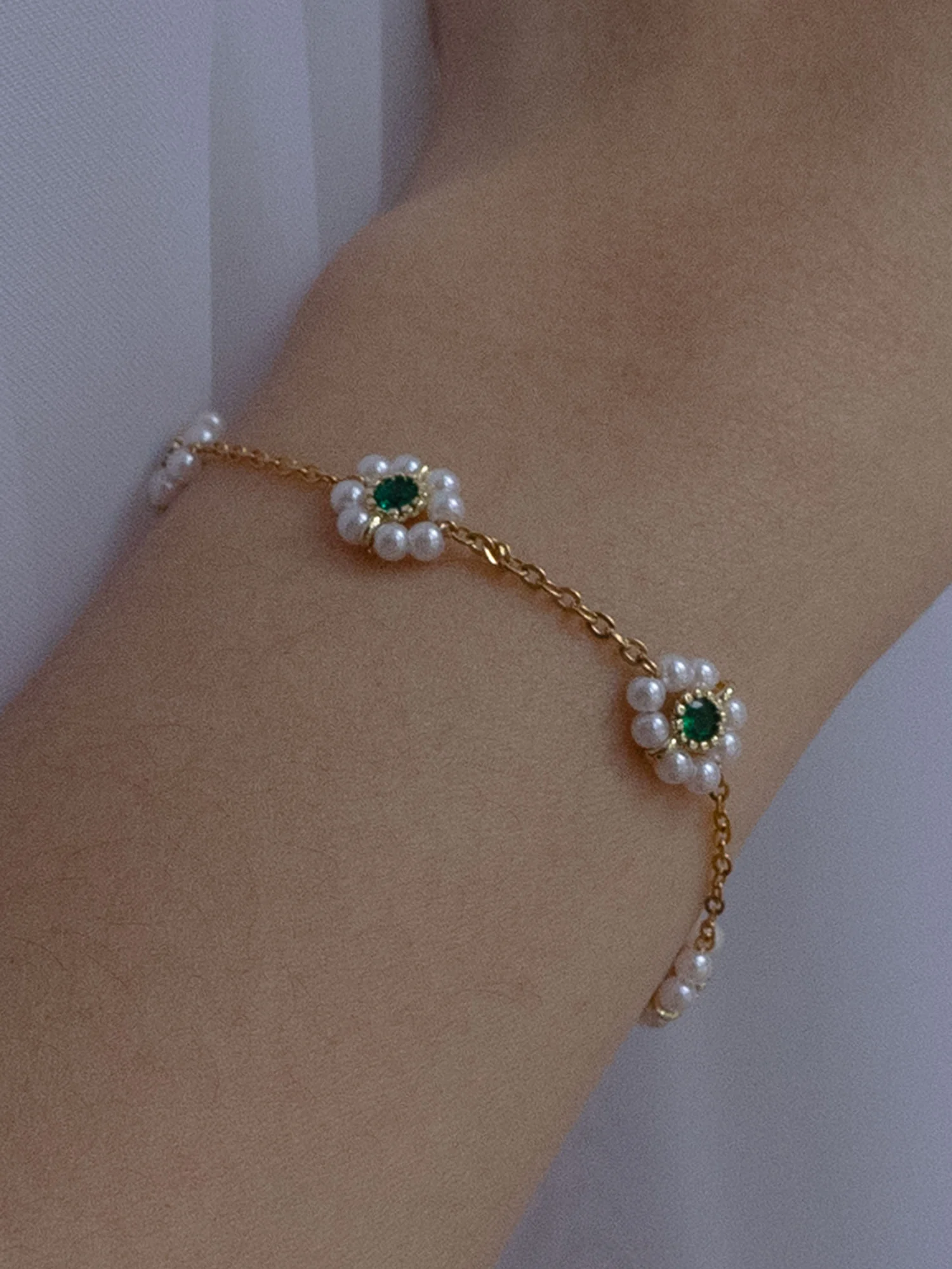Petite Pearl Flower Bracelet With Emerald Gemstones - Image 2